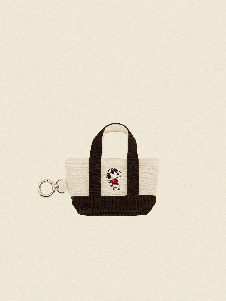 The Little Beast Snoopy Poop Bag Tote in Black or Red